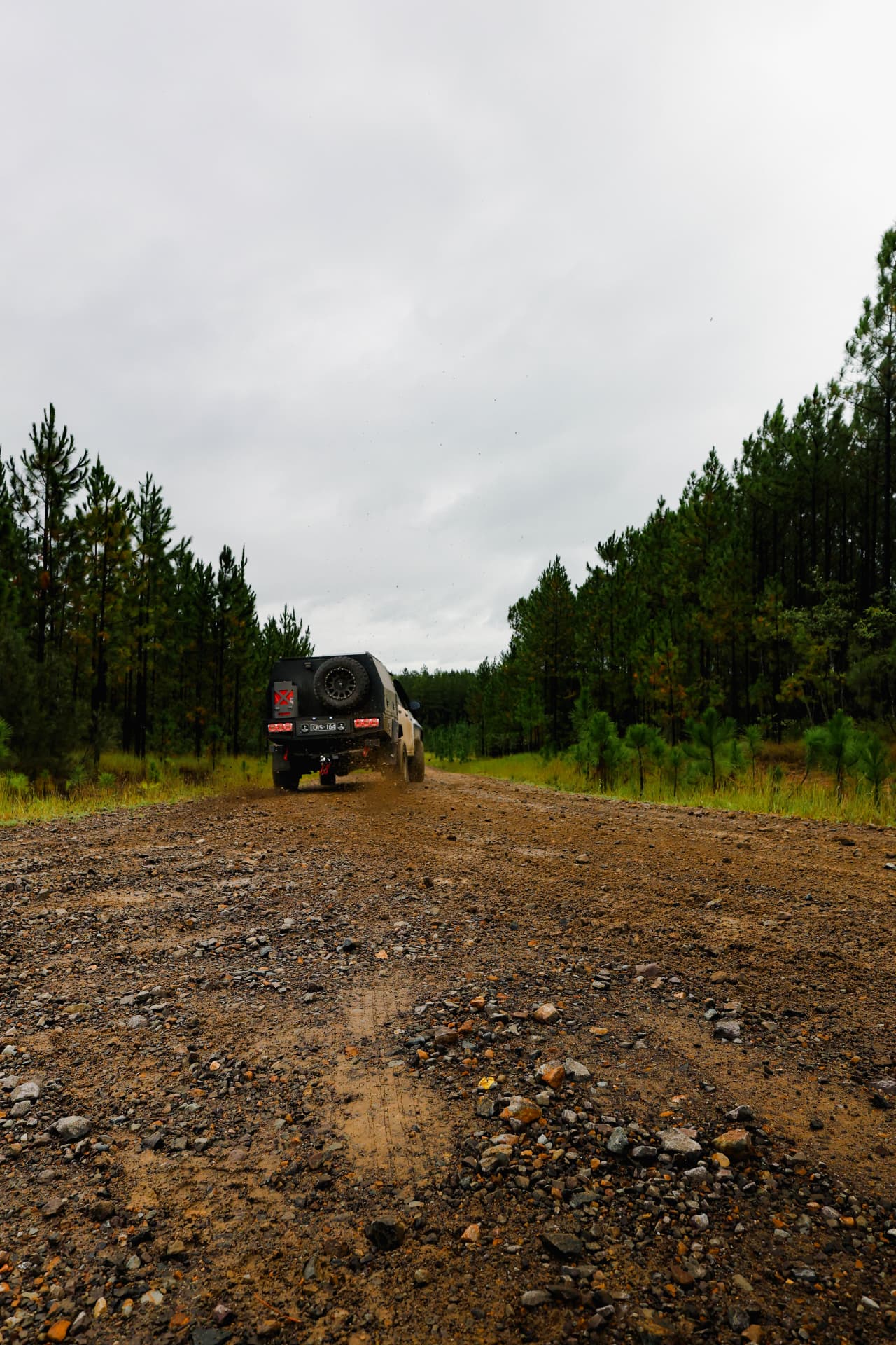 HiLux heading up a wet gravel track