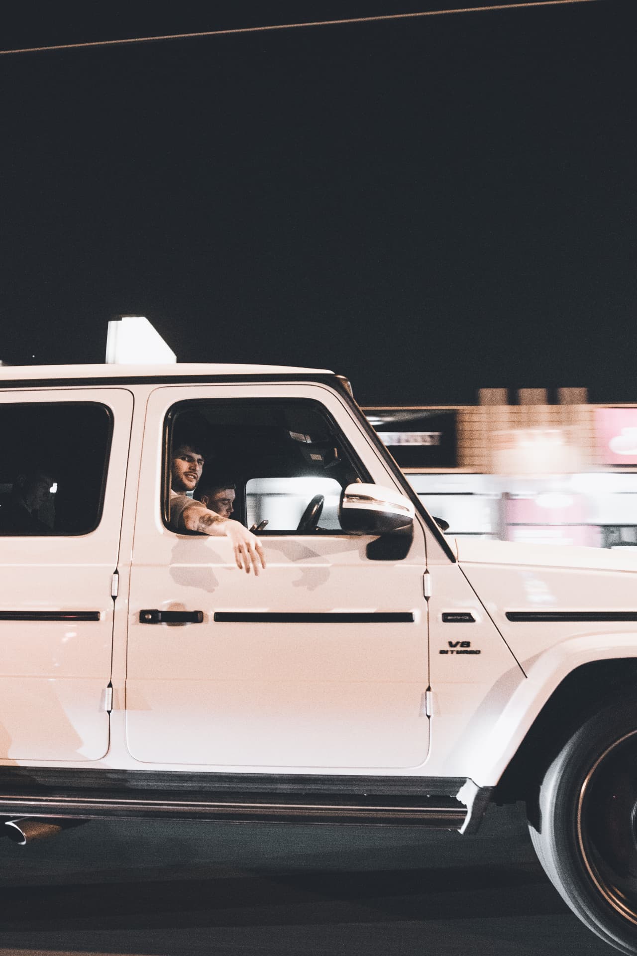 White G63 side rolling shot at night