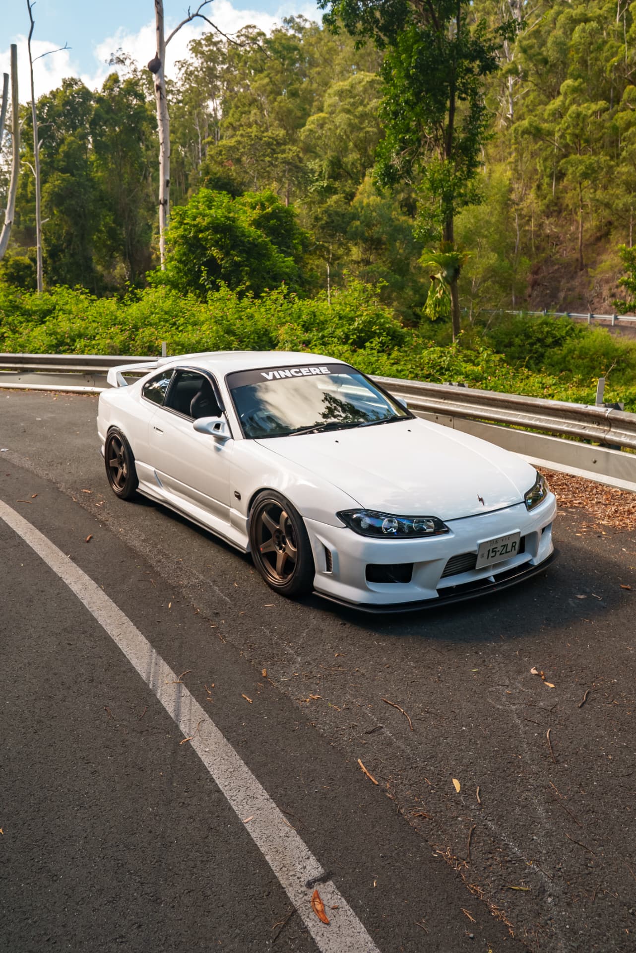 White Nissan Silvia S15 front three-quarter on a mountain road